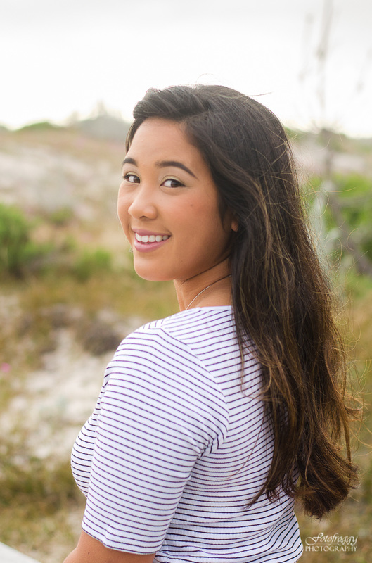 Senior girl portrait smiling over her shoulder at Asilomar, Pacific Grove Fotofroggy Photography 