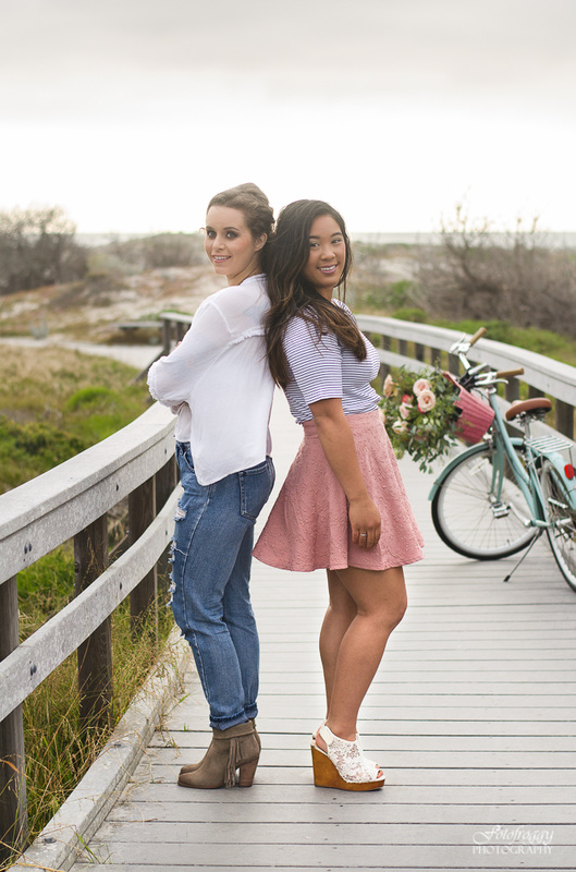 Two senior girls back to back with bike at Asilomar, Pacific Grove Fotofroggy Photography