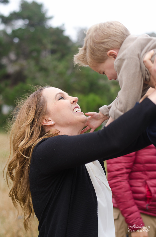 Mother holding son up in the air Pacific Grove portraits