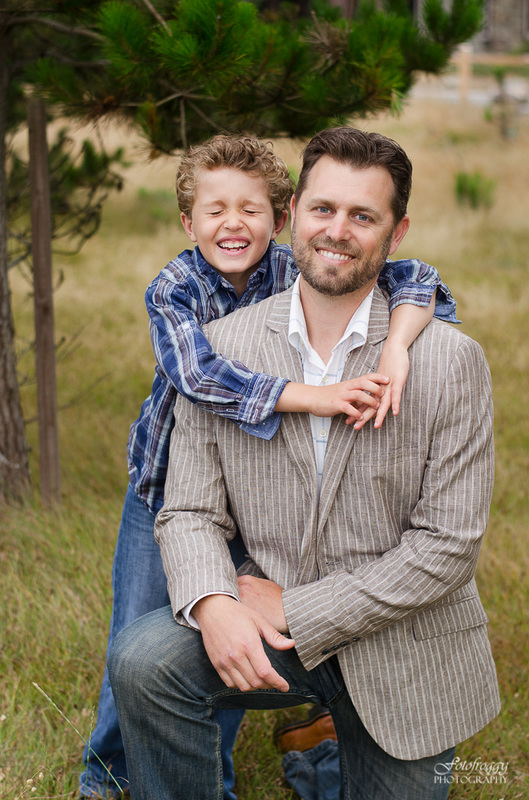 Father and son portrait eyes closed giggles