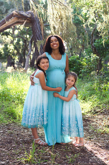 Mom and her 2 girls in light blue. Pacific Grove family portraits. www.fotofroggy.com