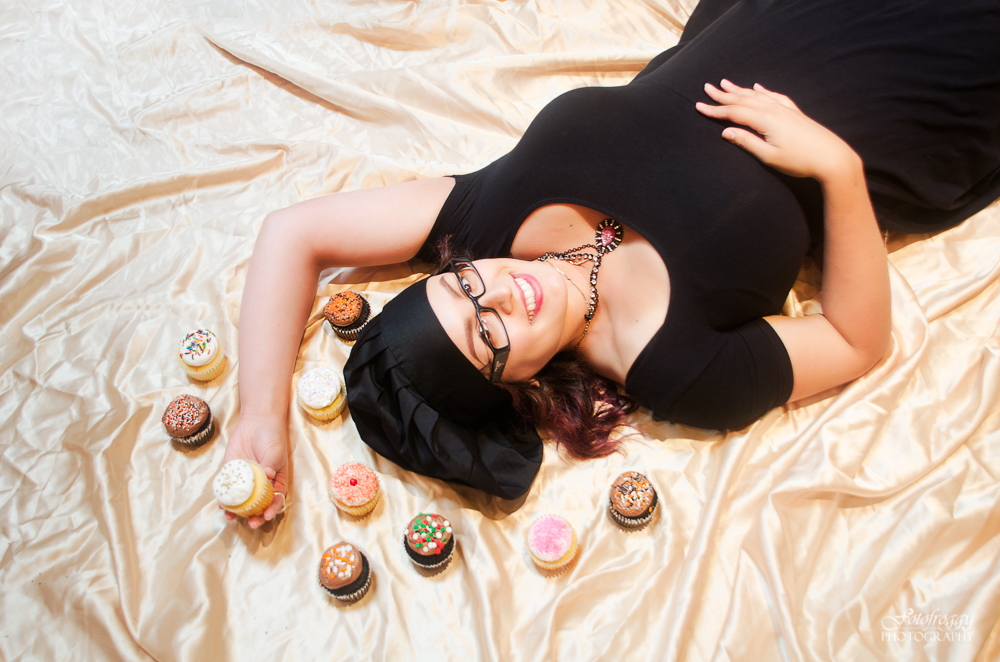 Giving Into Cyn - YouTube - Headshots laying down with cupcakes on gold satin