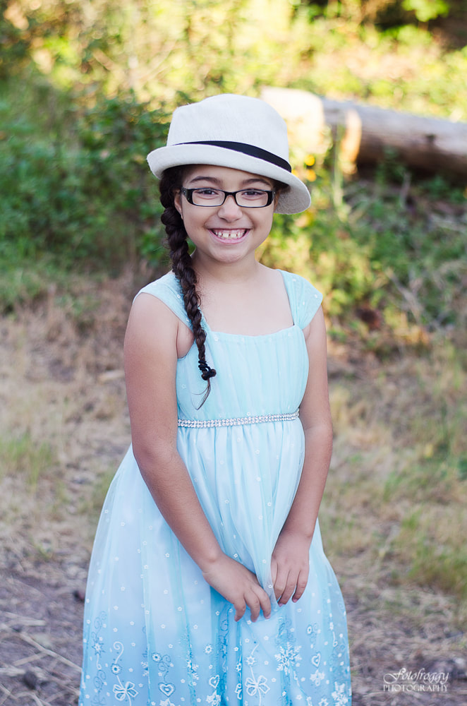 Adorable little girl in her stylish glasses and Daddy's hat. Pacific Grove Family photography. www.fotofroggy.com
