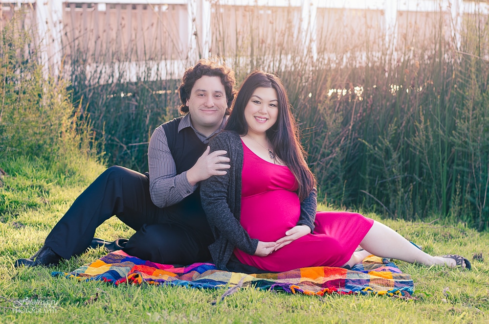 Couple's maternity portrait on grass with reeds. Monterey Bay family photographer www.fotofroggy.com